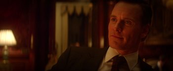 Movie still from “Haywire” (2011), directed by Steven Soderbergh – A person wearing a suit and tie; Close Up shot, Over the shoulder angle