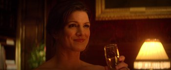 Movie still from “Haywire” (2011), directed by Steven Soderbergh – A beautiful woman holding a glass of wine; Close Up shot, Over the shoulder angle