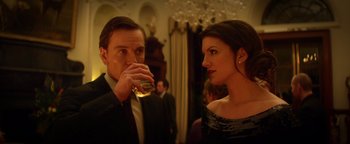 Movie still from “Haywire” (2011), directed by Steven Soderbergh – A man and a woman are drinking wine; Medium shot, Over the shoulder angle