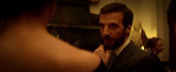 Movie still from “Haywire” (2011), directed by Steven Soderbergh – A man looking at himself in the mirror; Close Up shot, Over the shoulder angle