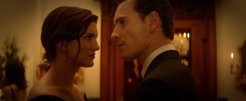 Movie still from “Haywire” (2011), directed by Steven Soderbergh – A man and a woman looking at each other in a room; Close Up shot, Low angle
