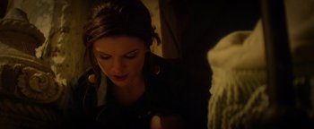 Movie still from “Haywire” (2011), directed by Steven Soderbergh – A person looking down at something; Close Up shot, Low angle