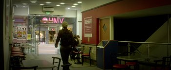 A man walking down the street in a store