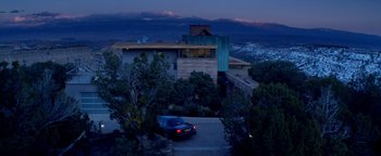Movie still from “Haywire” (2011), directed by Steven Soderbergh – A car parked in front of a house at night; Extreme Wide shot, High angle
