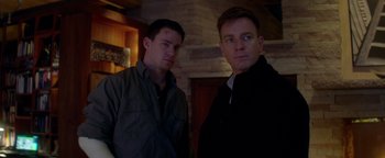 Movie still from “Haywire” (2011), directed by Steven Soderbergh – A couple of men standing next to each other; Close Up shot, Over the shoulder angle