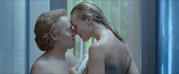 Movie still from “Headhunters” (2011), directed by Morten Tyldum – A man and a woman in the shower together; Close Up shot, Over the shoulder angle