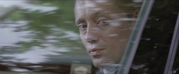 Movie still from “Headhunters” (2011), directed by Morten Tyldum – A person in a car; Close Up shot, Over the shoulder angle