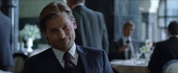 Movie still from “Headhunters” (2011), directed by Morten Tyldum – A man in a suit and a tie; Close Up shot, Over the shoulder angle