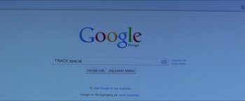 Movie still from “Headhunters” (2011), directed by Morten Tyldum – A computer screen showing a google page; Extreme Close Up shot, High angle