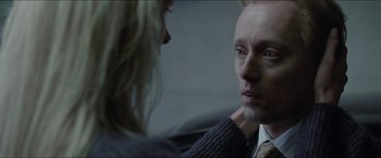 Movie still from “Headhunters” (2011), directed by Morten Tyldum – A man and a woman looking into each other's eyes; Close Up shot, Over the shoulder angle