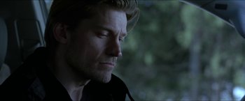 Movie still from “Headhunters” (2011), directed by Morten Tyldum – A person with his eyes closed; Close Up shot, Low angle