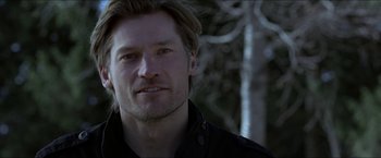 Movie still from “Headhunters” (2011), directed by Morten Tyldum – A person wearing a black shirt; Close Up shot, Over the shoulder angle