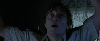 Movie still from “Headhunters” (2011), directed by Morten Tyldum – A person looking up at the sky; Close Up shot, Overhead angle