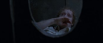 Movie still from “Headhunters” (2011), directed by Morten Tyldum – A man looking at himself in a mirror; Close Up shot, High angle