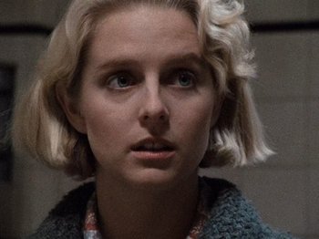 Movie still from “Henry: Portrait of a Serial Killer” (1986), directed by John McNaughton – A person with short blonde hair; Close Up shot, Low angle
