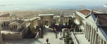 Movie still from “Hercules” (2014), directed by Brett Ratner – An aerial view of a city with a statue of a man in the center; Extreme Wide shot, High angle