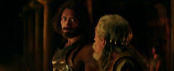 Movie still from “Hercules” (2014), directed by Brett Ratner – A man with a long beard and a man with a long beard; Close Up shot, Over the shoulder angle