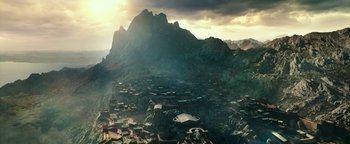 Movie still from “Hercules” (2014), directed by Brett Ratner – An aerial view of a city with mountains in the background; Extreme Wide shot, High angle