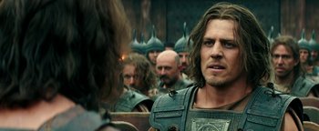 Movie still from “Hercules” (2014), directed by Brett Ratner – A group of men in helmets are looking in the same direction; Close Up shot, Over the shoulder angle