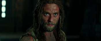 Movie still from “Hercules” (2014), directed by Brett Ratner – A person with long hair and a beard; Close Up shot, Low angle
