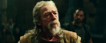 Movie still from “Hercules” (2014), directed by Brett Ratner – An old man with a long white beard looking into the distance; Close Up shot, Low angle