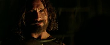 Movie still from “Hercules” (2014), directed by Brett Ratner – A person with long hair and a beard; Close Up shot, Over the shoulder angle
