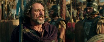 Movie still from “Hercules” (2014), directed by Brett Ratner – An old man with a beard and a mustache; Close Up shot, Low angle