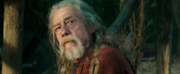 Movie still from “Hercules” (2014), directed by Brett Ratner – An old man with long white hair and a beard; Close Up shot, Low angle