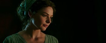 Movie still from “Hercules” (2014), directed by Brett Ratner – A beautiful woman in a green dress looking to her left; Close Up shot, Over the shoulder angle