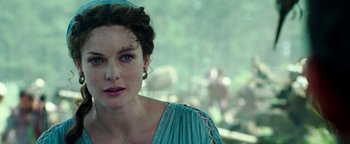 Movie still from “Hercules” (2014), directed by Brett Ratner – A person wearing a blue dress; Close Up shot, Low angle