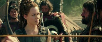 Movie still from “Hercules” (2014), directed by Brett Ratner – A woman and a man are standing in a field; Close Up shot, Over the shoulder angle