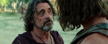 Movie still from “Hercules” (2014), directed by Brett Ratner – An older man with a beard and a mustache; Close Up shot, Over the shoulder angle