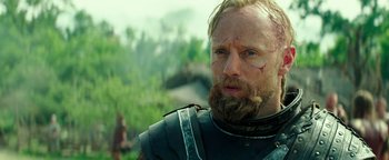 Movie still from “Hercules” (2014), directed by Brett Ratner – A person with a beard wearing armor; Close Up shot, Over the shoulder angle