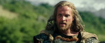 Movie still from “Hercules” (2014), directed by Brett Ratner – A person with long hair and a beard; Close Up shot, Low angle
