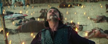 Movie still from “Hercules” (2014), directed by Brett Ratner – A man with long hair and a beard wearing a leather vest; Close Up shot, Low angle