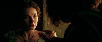 Movie still from “Hercules” (2014), directed by Brett Ratner – A woman looking at a man in a room; Close Up shot, Over the shoulder angle