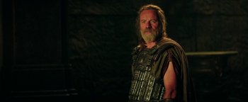 Movie still from “Hercules” (2014), directed by Brett Ratner – A man with a beard wearing a leather vest; Medium shot, Over the shoulder angle