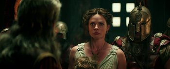Movie still from “Hercules” (2014), directed by Brett Ratner – A woman in a dress looking at a mirror; Close Up shot, Over the shoulder angle