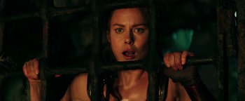 Movie still from “Hercules” (2014), directed by Brett Ratner – A woman in a jail cell with her mouth open; Close Up shot, Low angle