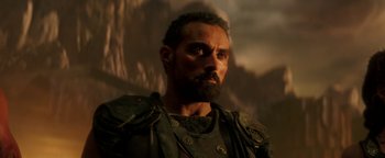 Movie still from “Hercules” (2014), directed by Brett Ratner – A man with a beard wearing a leather jacket; Close Up shot, Low angle