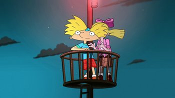 Movie still from “Hey Arnold: The Jungle Movie” (2017), directed by Raymie Muzquiz – A couple of people standing next to each other; Wide shot, Low angle