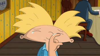 Movie still from “Hey Arnold: The Jungle Movie” (2017), directed by Raymie Muzquiz – A cartoon character with his hand to his face; Close Up shot, High angle