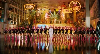 Movie still from “High School Musical 3: Senior Year” (2008), directed by Kenny Ortega – A group of dancers in black outfits on a stage; Extreme Wide shot, Low angle