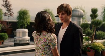 Movie still from “High School Musical 3: Senior Year” (2008), directed by Kenny Ortega – A man and a woman standing next to each other; Medium shot, Over the shoulder angle