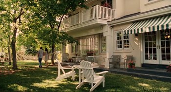 Movie still from “High School Musical 3: Senior Year” (2008), directed by Kenny Ortega – Two white lawn chairs sitting in front of a house; Wide shot, High angle