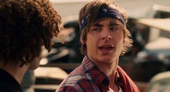 Movie still from “High School Musical 3: Senior Year” (2008), directed by Kenny Ortega – A young man with a bandana on his head; Close Up shot, Over the shoulder angle