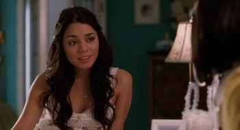 Movie still from “High School Musical 3: Senior Year” (2008), directed by Kenny Ortega – A beautiful young lady sitting in a living room; Close Up shot, Over the shoulder angle