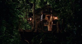 Movie still from “High School Musical 3: Senior Year” (2008), directed by Kenny Ortega – A man standing on top of a wooden structure; Wide shot, Low angle