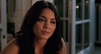 Movie still from “High School Musical 3: Senior Year” (2008), directed by Kenny Ortega – A beautiful young woman with long black hair; Close Up shot, Over the shoulder angle