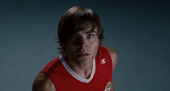 Movie still from “High School Musical 3: Senior Year” (2008), directed by Kenny Ortega – A person wearing a red shirt; Close Up shot, Low angle